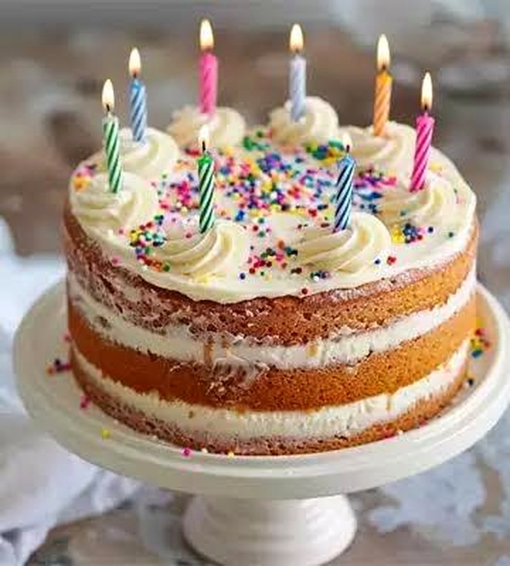 Layered Golden Stream cake with candles